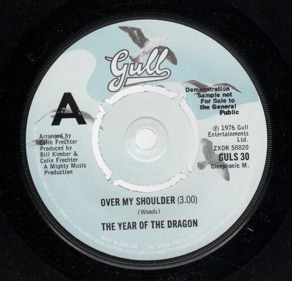 The Year Of The Dragon - Over My Shoulder / Let's Do The Latin Hustle